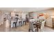Spacious kitchen with an island, stainless steel appliances, and granite countertops at 8465 Las Palmas Way, Wildwood, FL 34785