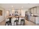 Modern kitchen featuring granite countertops and stainless steel appliances at 8465 Las Palmas Way, Wildwood, FL 34785