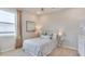 Cozy bedroom featuring a single bed, window, and tasteful decor at 8552 Pinecrest Trl, Wildwood, FL 34785