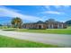 Community center exterior with brick facade, green lawn, and a paved pathway at 9393 Sw 101St Ln, Ocala, FL 34481