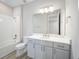 Modern bathroom with white vanity, shower, and bathtub at 9781 Sw 79Th Lane Rd, Ocala, FL 34481