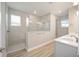 Modern bathroom with a large glass shower and double vanity at 9781 Sw 79Th Lane Rd, Ocala, FL 34481