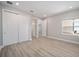 Bedroom with window, double door closet, and wood floors at 9781 Sw 79Th Lane Rd, Ocala, FL 34481
