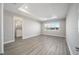 Spacious bedroom with large window and wood-look flooring at 9781 Sw 79Th Lane Rd, Ocala, FL 34481