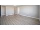 Bright bedroom with wood-look flooring and access to closet at 9781 Sw 79Th Lane Rd, Ocala, FL 34481