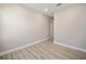 Simple bedroom with wood-look floors and neutral walls at 9781 Sw 79Th Lane Rd, Ocala, FL 34481