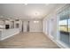 Dining room with vinyl flooring, large windows, and adjacent kitchen at 9781 Sw 79Th Lane Rd, Ocala, FL 34481