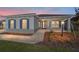 One-story home with gray siding, blue shutters, and a covered porch at 9781 Sw 79Th Lane Rd, Ocala, FL 34481