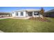 One-story house with gray siding, blue shutters, and a landscaped yard at 9781 Sw 79Th Lane Rd, Ocala, FL 34481