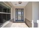 Front entry features a blue door with glass accents and a paver walkway at 9781 Sw 79Th Lane Rd, Ocala, FL 34481