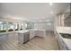 Open concept kitchen with large island and stainless steel appliances at 9781 Sw 79Th Lane Rd, Ocala, FL 34481