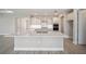 Modern kitchen with large island, stainless steel appliances, and white cabinetry at 9781 Sw 79Th Lane Rd, Ocala, FL 34481
