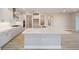 Modern kitchen with white cabinets, stainless steel appliances, and a large island at 9781 Sw 79Th Lane Rd, Ocala, FL 34481