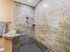 Large walk-in shower with modern tile and bench at 1166 Cr 441, Lake Panasoffkee, FL 33538