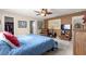 Primary bedroom with king bed and walk-in closet at 13746 Se 88Th Ave, Summerfield, FL 34491