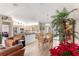 Kitchen and dining area with light wood cabinets and hardwood floors at 13746 Se 88Th Ave, Summerfield, FL 34491