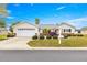 One-story home with attached garage, landscaping, and a mailbox at 13746 Se 88Th Ave, Summerfield, FL 34491