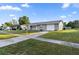 Front exterior view of a single-story home with an attached garage at 15127 Sw 43Rd Terrace Rd, Ocala, FL 34473