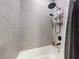 Modern bathroom with gray tile, shower, and bathtub at 15720 Sw 19Th Ter, Ocala, FL 34473