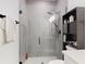 Bathroom boasts a glass-enclosed shower, gray tile, and modern fixtures at 15720 Sw 19Th Ter, Ocala, FL 34473
