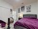 Bedroom with purple bed, closet, and wall art at 15720 Sw 19Th Ter, Ocala, FL 34473