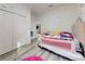 bedroom with pastel decor, built-in closet, and access to the living area at 15720 Sw 19Th Ter, Ocala, FL 34473