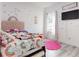 Whimsical bedroom with colorful decor, a bed, and a large window at 15720 Sw 19Th Ter, Ocala, FL 34473