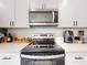 Modern kitchen with stainless steel appliances, white countertops, and ample storage at 15720 Sw 19Th Ter, Ocala, FL 34473