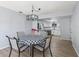 Dining room with black chandelier and checkered tablecloth at 17973 Se 104Th Ter, Summerfield, FL 34491