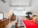 Bedroom with a red comforter, wood furniture and vaulted ceiling at 26 Hemlock Cir, Ocala, FL 34472