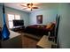 Bedroom with a queen bed, large TV, and ample closet space at 3729 Se 38Th Ter, Ocala, FL 34480