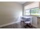 Charming breakfast nook with a window seat and two white chairs at 41 Hickory Trak, Ocala, FL 34472