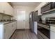 Modern kitchen featuring stainless steel appliances and granite countertops at 41 Hickory Trak, Ocala, FL 34472