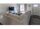 Comfortable living room with sectional sofa, TV and plenty of natural light at 41 Hickory Trak, Ocala, FL 34472