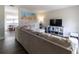 Spacious living room with light beige sectional sofa and wood-look floors at 41 Hickory Trak, Ocala, FL 34472