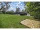 Landscaped backyard with a private dock at 4121 Sw 6Th Ave, Ocala, FL 34471