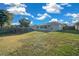 Large backyard with covered patio, above ground pool, and shed at 4367 Se 106Th Pl, Belleview, FL 34420