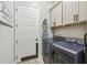 Laundry room with washer, dryer, and ample storage at 4522 Shockoe Cir, The Villages, FL 32163