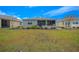 Large backyard with screened patio perfect for entertaining at 7932 Sw 89Th Cir, Ocala, FL 34481