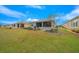 Expansive backyard featuring a screened patio and well-maintained lawn at 7932 Sw 89Th Cir, Ocala, FL 34481