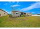 Spacious backyard with screened-in patio and lush green lawn at 7932 Sw 89Th Cir, Ocala, FL 34481