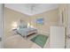 Bedroom with ceiling fan and area rug at 7932 Sw 89Th Cir, Ocala, FL 34481
