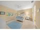 Comfortable bedroom with ceiling fan, plush carpeting, and windows offering natural light at 7932 Sw 89Th Cir, Ocala, FL 34481