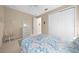 Bedroom with ceiling fan, dresser, area rug, and closet at 7932 Sw 89Th Cir, Ocala, FL 34481