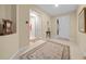 Welcoming entryway with decorative rug and access to other rooms at 7932 Sw 89Th Cir, Ocala, FL 34481