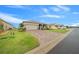Front exterior view of a single-story home with a paved driveway and attached garage at 7932 Sw 89Th Cir, Ocala, FL 34481