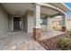 Inviting front porch with stone accents and paver walkway at 7932 Sw 89Th Cir, Ocala, FL 34481