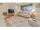 Living room with comfortable furniture, a large window, and a rocking chair at 7932 Sw 89Th Cir, Ocala, FL 34481