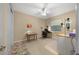 Home office with a desk, chair, and ceiling fan at 7932 Sw 89Th Cir, Ocala, FL 34481