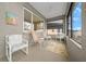 Relaxing screened porch with comfortable seating and decorative rug at 7932 Sw 89Th Cir, Ocala, FL 34481